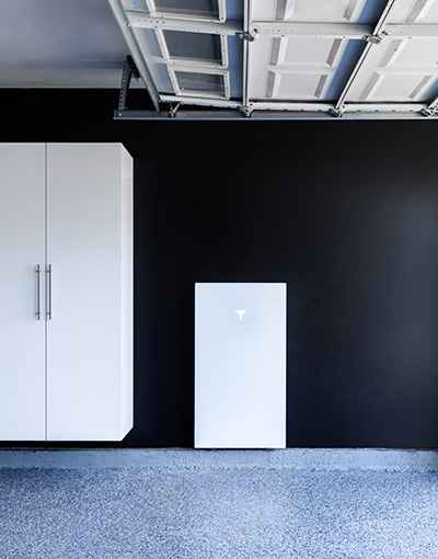 Teslar powerwall on a garage wall