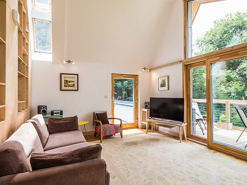 Living room with 21 Degrees french doors and windows