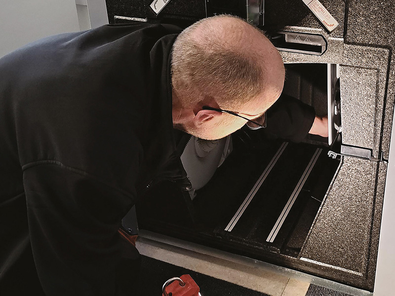 A man servicing an MVHR unit